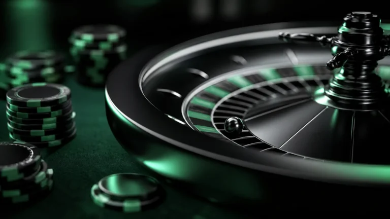 roulette wheel and casino chips close-up on dark green felt